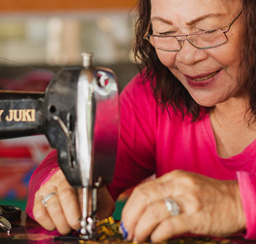 Philippino woman sewing
