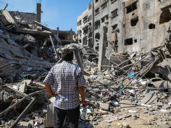 Gaza man watching distructions