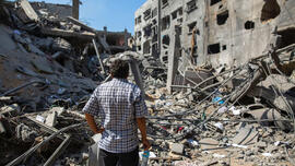 Gaza man watching distructions