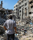 Gaza man watching distructions